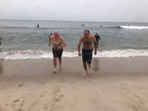 Twomey Latham legal team leaving the water at polar plunge